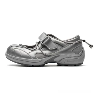 Silver grey Trek-Strap technical Mary Jane sneakers shown in left profile with mesh side panels, adjustable velcro instep strap, heel drawstring toggle, quilted toe, and chunky rubber outsole