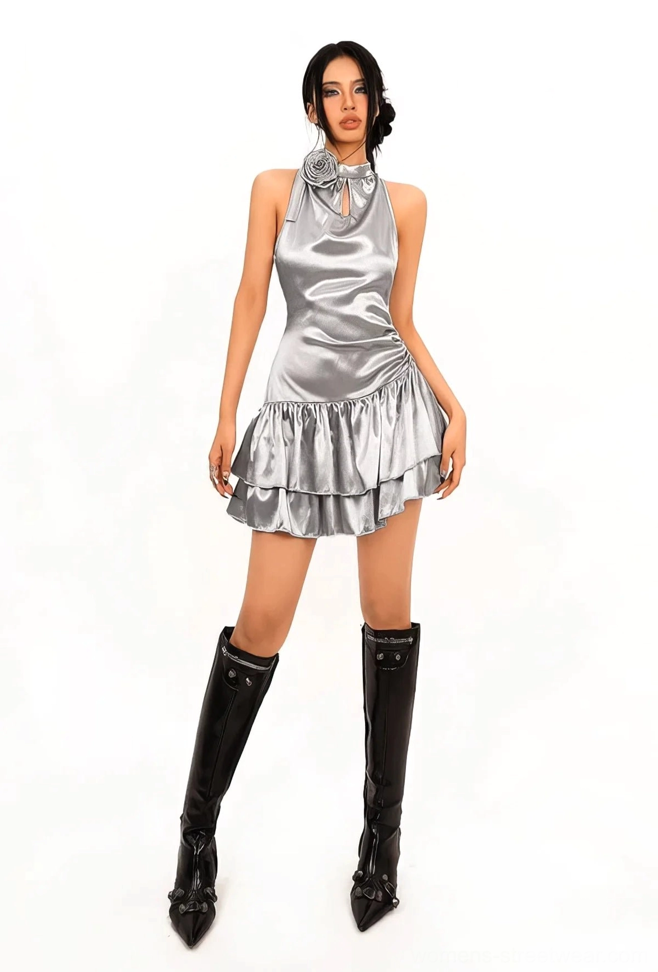 Full front view of a silver metallic halter cocktail mini dress with front keyhole neckline, 3D flower decoration, fitted bodycon shape, and glossy finish