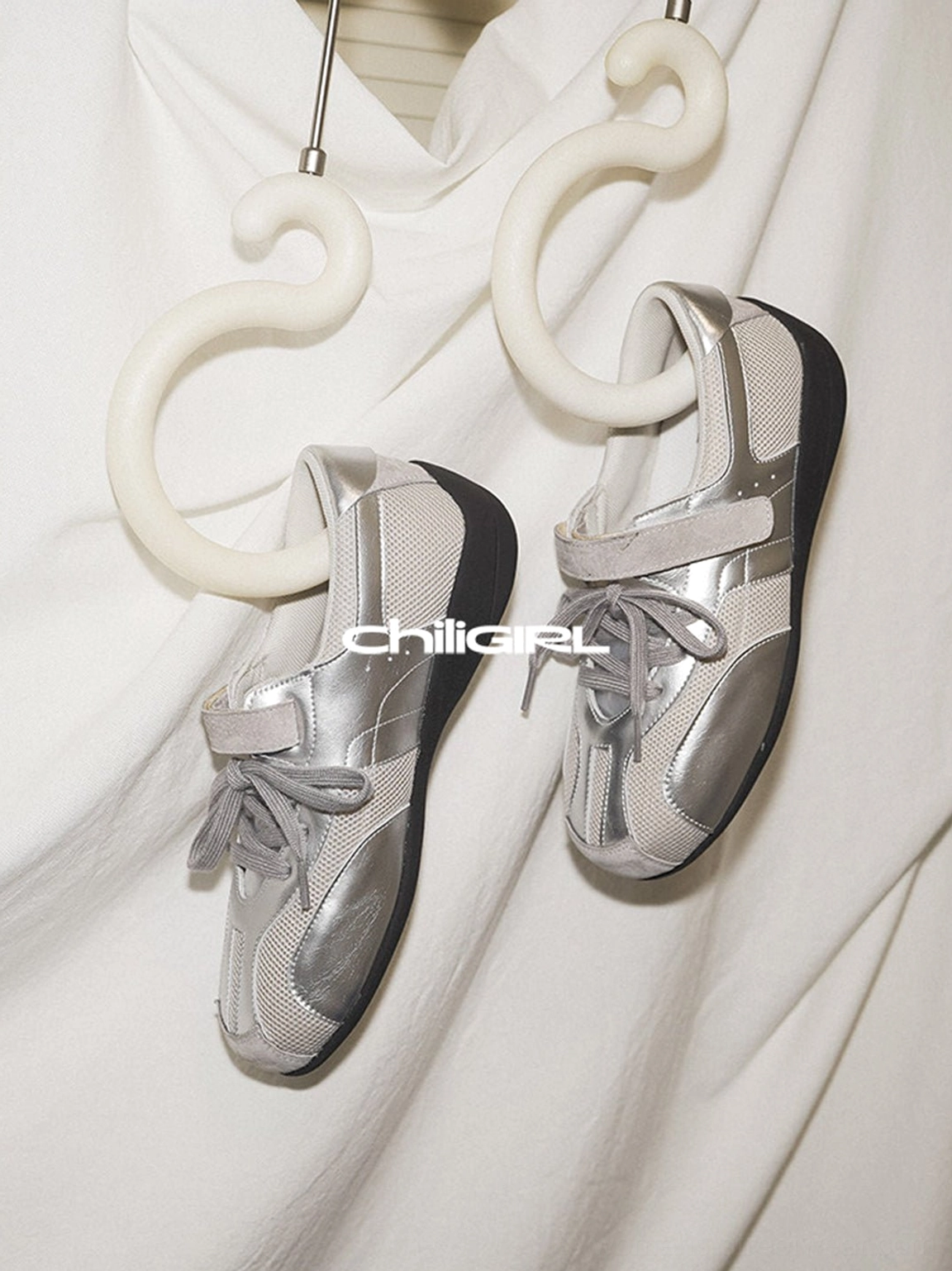 Silver metallic mesh streetwear sneakers shown in an additional product view with adjustable straps and contrasting black sole