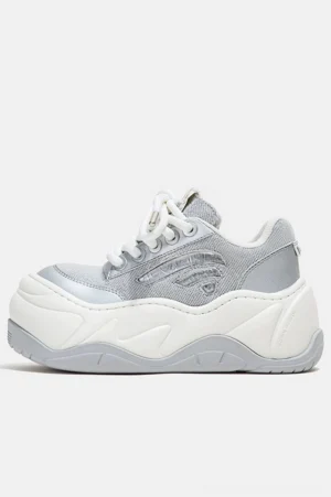 Silver metallic mesh wave platform chunky sneakers in side profile with layered white rubber sole