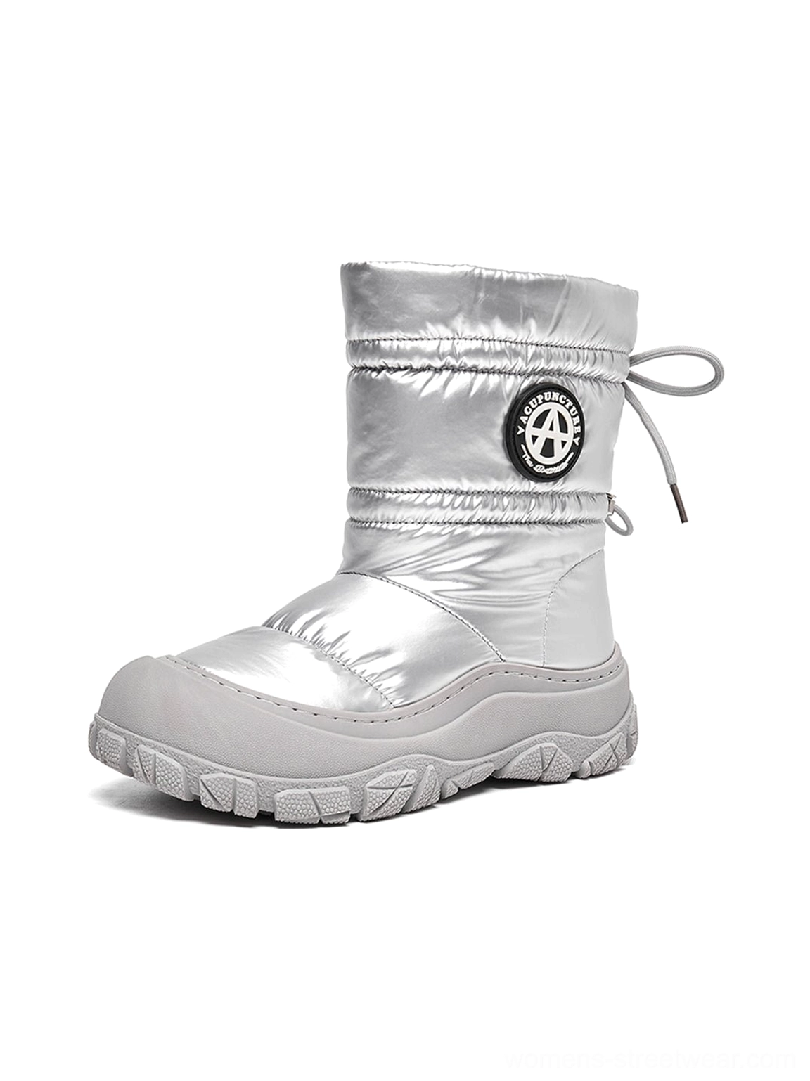 Full right-side studio view of a silver metallic puffer snow boot with quilted padded upper, drawstring collar, and chunky grey outsole