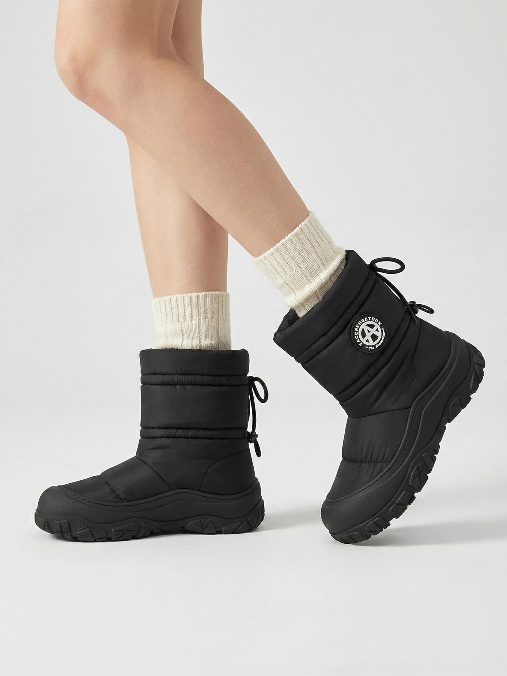 Silver metallic puffer snow boots image showing the futuristic winter streetwear design and cushioned silhouette