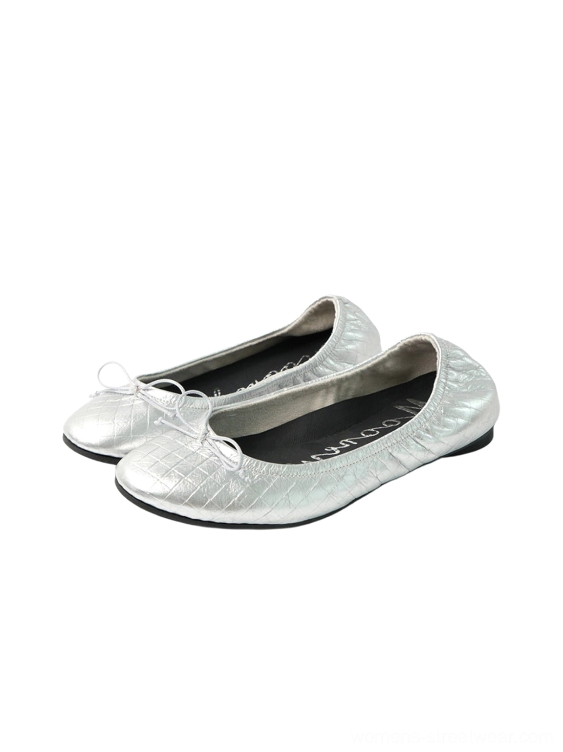 Silver metallic quilted bow ballet flats showing the textured upper and elegant low profile silhouette
