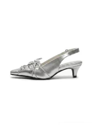 Silver pointed-toe kitten heel slingback shoe with bow vamp detail and delicate ankle strap, side product view