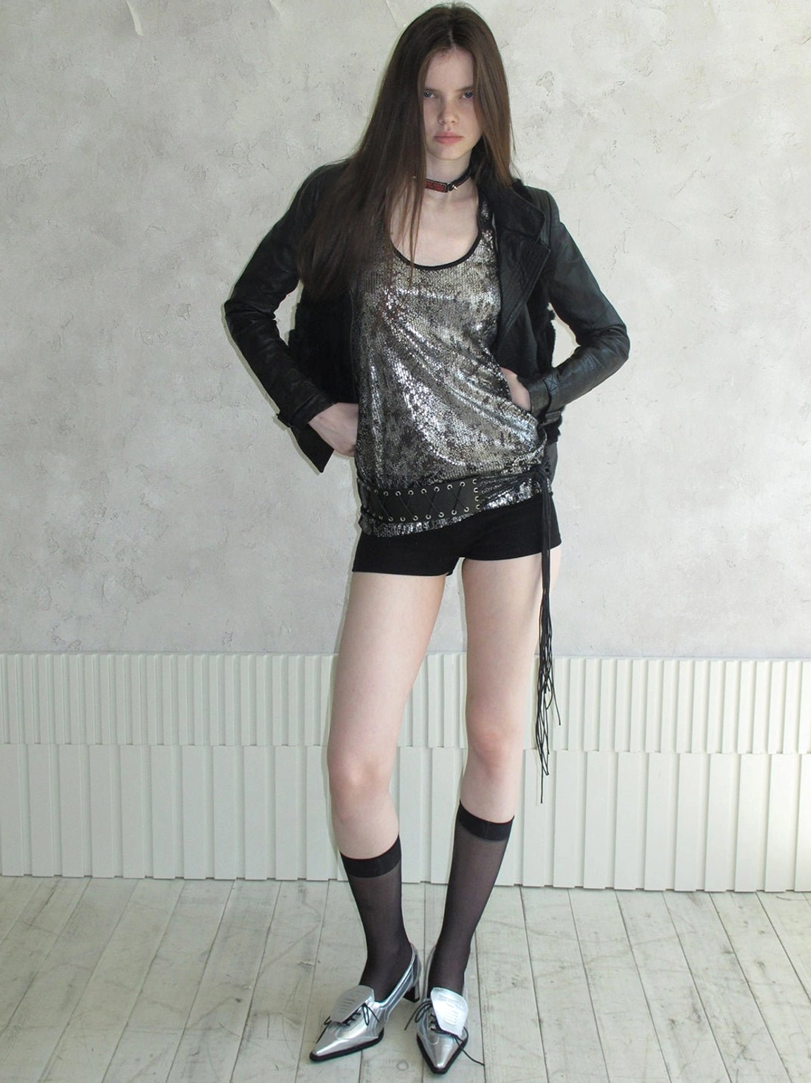 Silver pointed-toe leather-look pumps styled with black leather jacket sequined camisole and choker