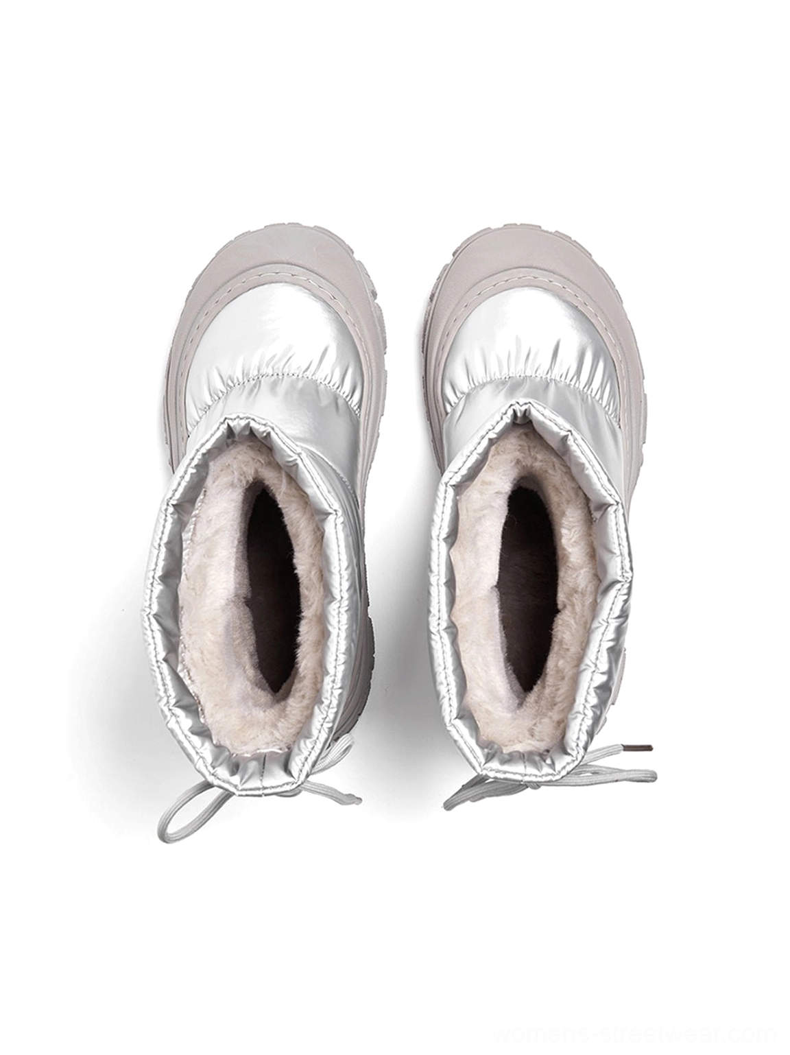 Top-down view inside silver puffer snow boots showing the soft fuzzy lining, pull-on opening, and adjustable drawstring toggles