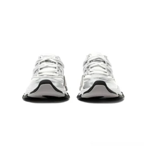 Front view of silver white streetwear runner sneakers featuring a metallic silver toe cap, mesh and synthetic leather upper, chunky sculpted sole, and black outsole trim
