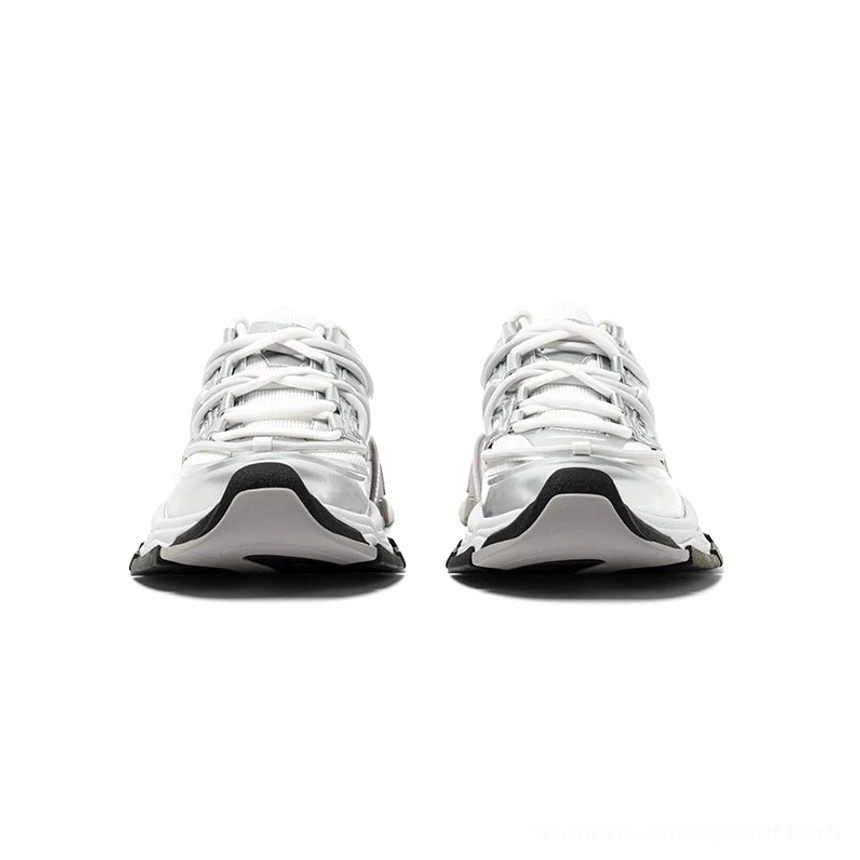 Front view of silver white streetwear runner sneakers featuring a metallic silver toe cap, mesh and synthetic leather upper, chunky sculpted sole, and black outsole trim