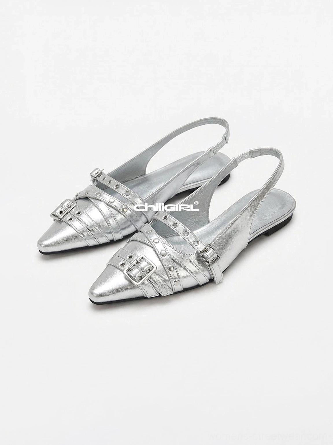 Silver Y2K pointed-toe double-buckle slingback flats with metallic finish, open heel, rivet accents, and low flat sole