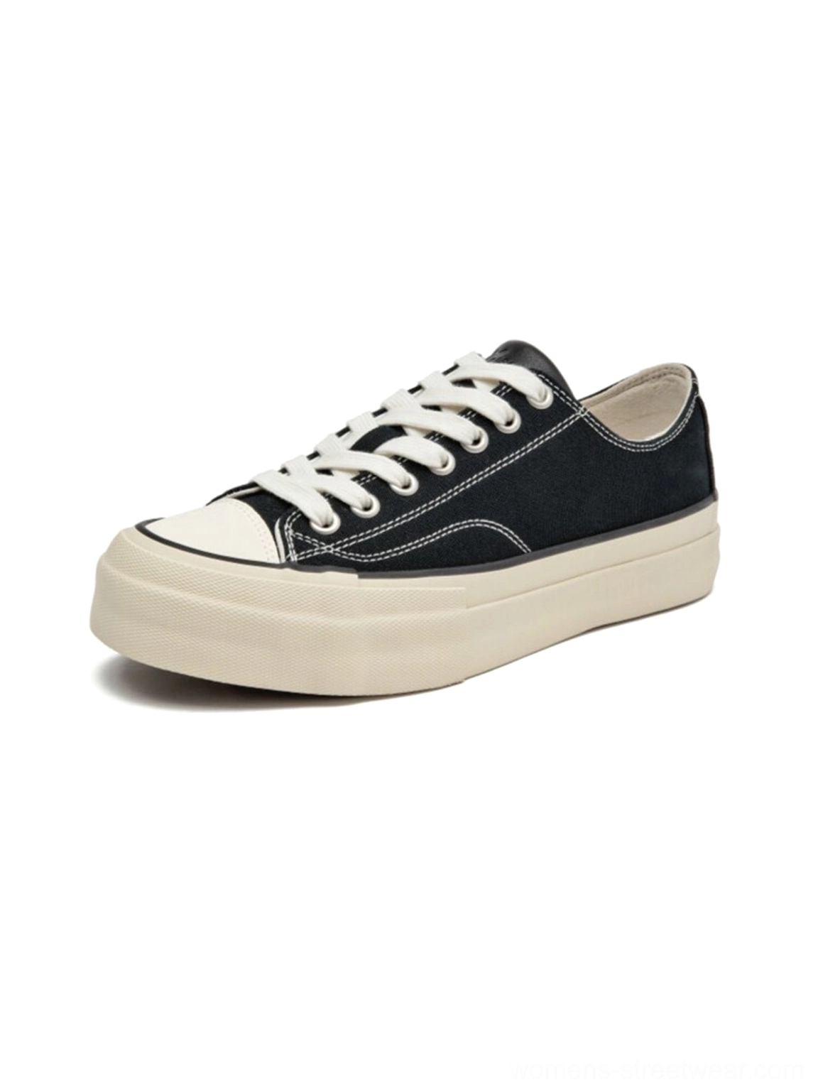 Left side flat single black canvas platform sneaker with cork midsole, visible thick off-white sole and precise upper stitch lines