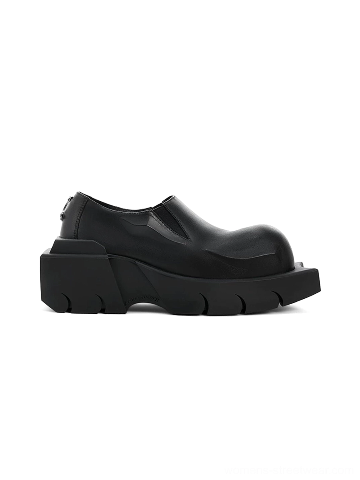 Single black leather slip-on platform derby shoe showing the smooth upper, raised vamp, rear pull tab, and thick ridged sole