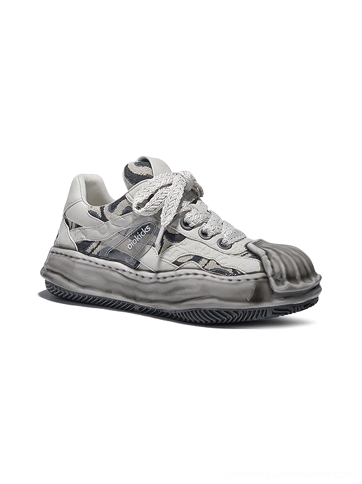 Single distressed camo shell-toe leather skate sneaker showing layered lace straps, side detail, weathered upper, and signature melted rubber outsole