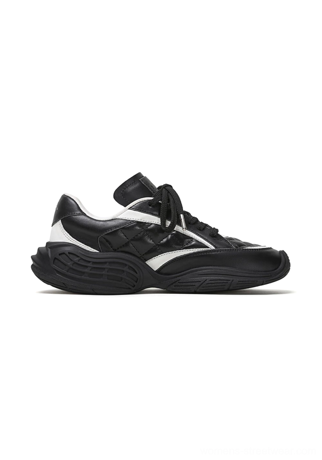 Single low-profile quilted leather sport sneaker shown from the side with a streamlined silhouette and curved overlay