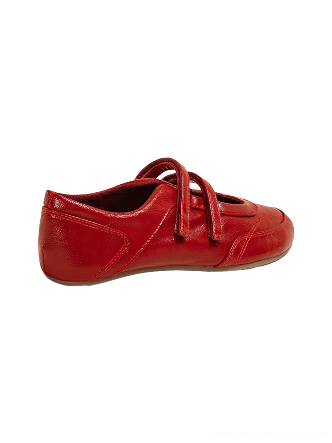 Single red crisscross strap leather-look flat shoe in side profile with rounded toe and flexible sole