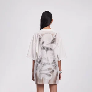 Back view of an off-white oversized skeleton streetwear tee dress showing spine artwork and relaxed loose silhouette