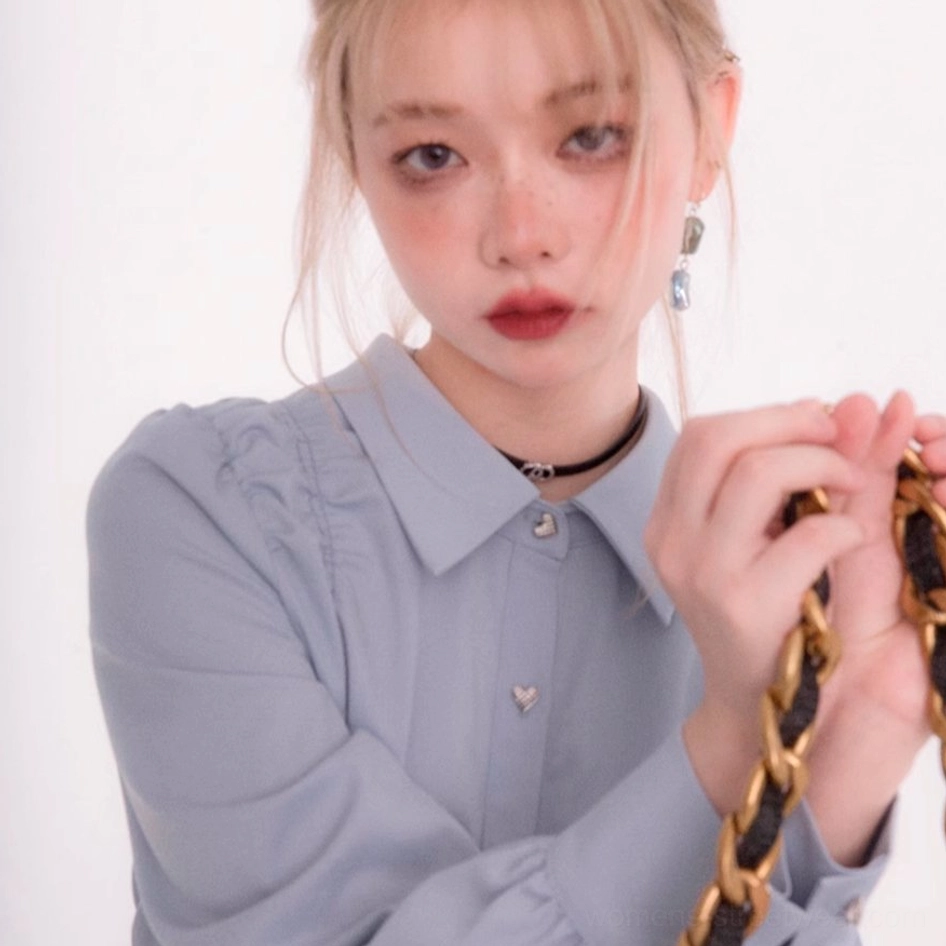 Sky blue long sleeve heart button streetwear blouse front view styled with chain shoulder bag