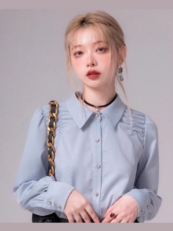 Sky blue heart button ruched shoulder streetwear blouse front close-up on model with pointed collar