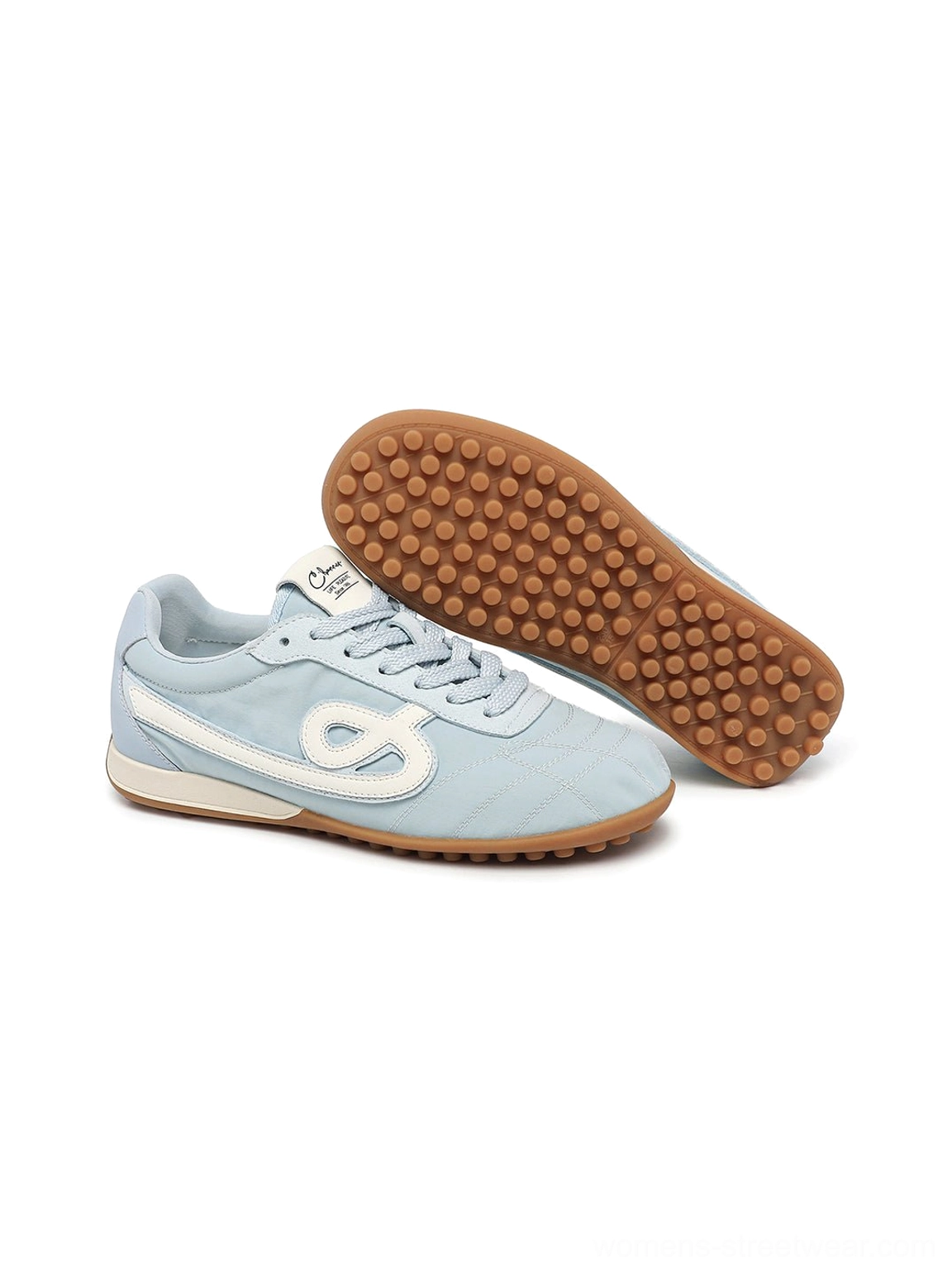 Angled product view of sky blue quilted gum sole retro streetwear sneakers showing contrast side detail