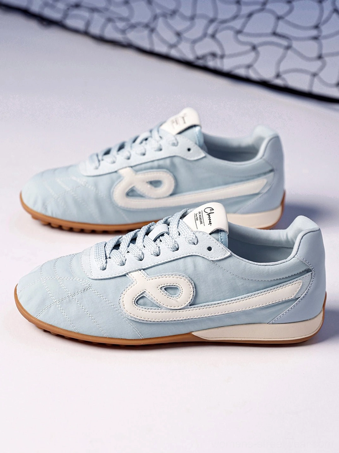 Sky blue quilted gum sole retro streetwear sneakers close-up design detail