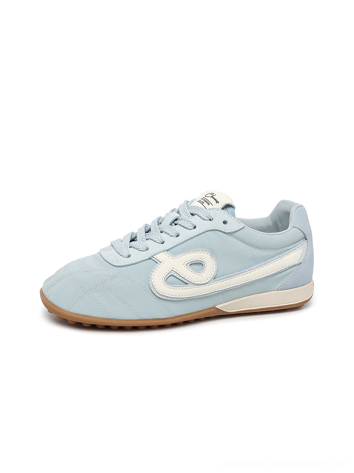 Sky blue quilted gum sole retro streetwear sneaker lateral view with lace-up low-top silhouette
