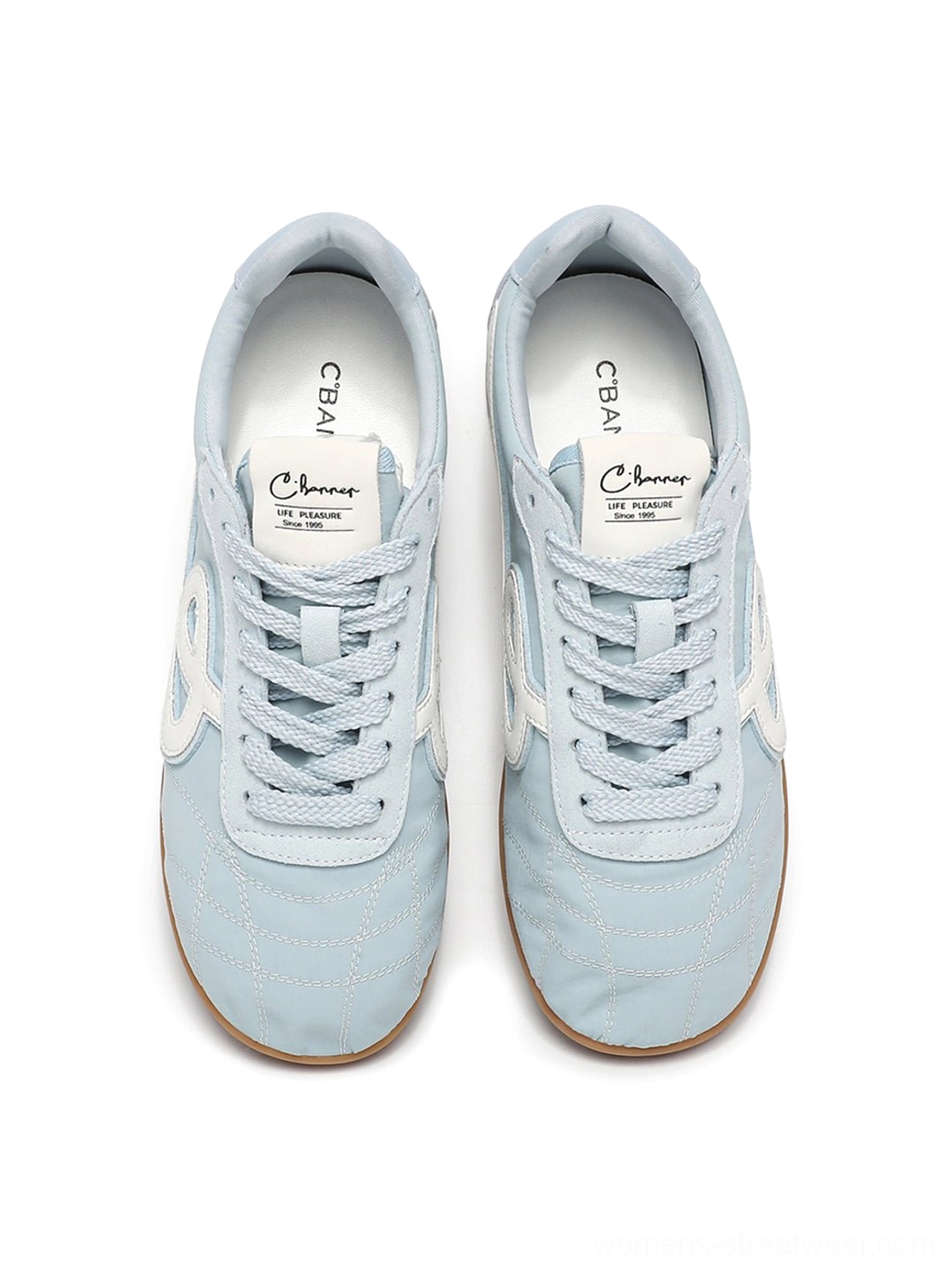 Top view of pair of sky blue quilted gum sole retro streetwear sneakers with branded style insoles