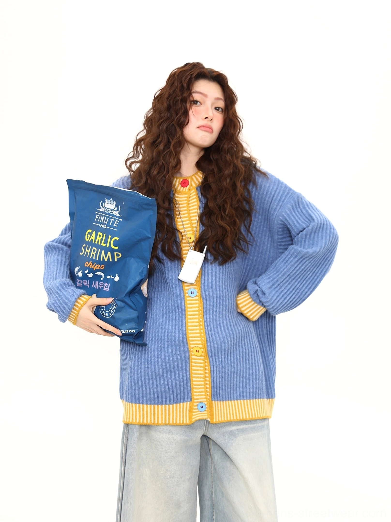 Sky blue contrast knit cardigan with yellow edging and front buttons styled in a relaxed oversized streetwear outfit