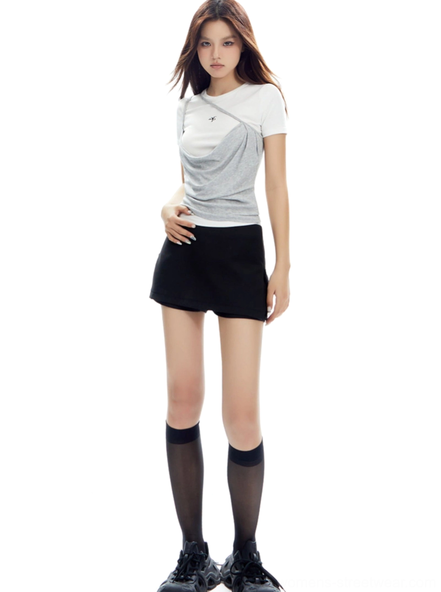 Sleek low-rise mini skirt fashion product image highlighting the straight streetwear silhouette and split hem