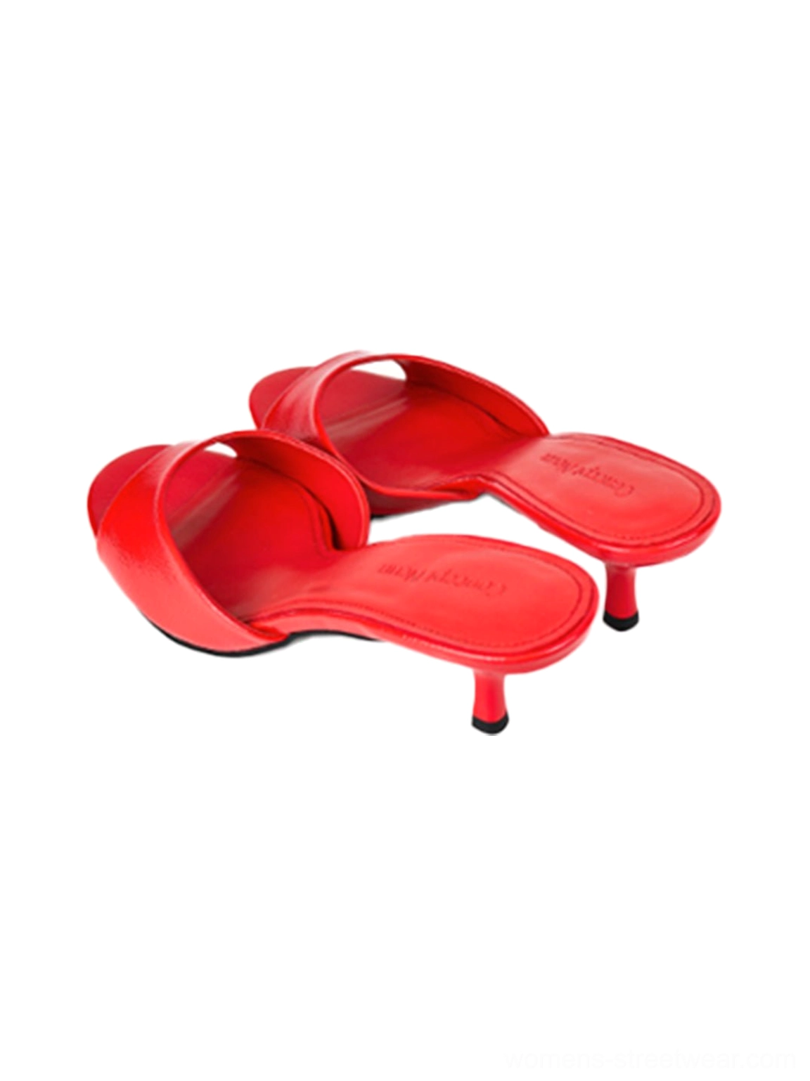 Sleek patent open-toe mules with low tapered heels for dresses, denim, and tailored outfits