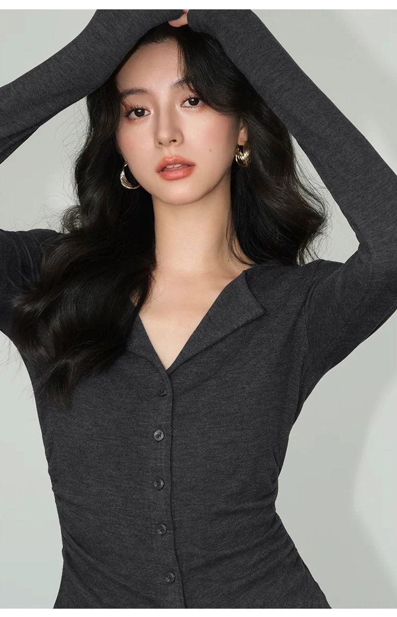 Dark gray fitted button-front knit cardigan top with notched lapel and long sleeves shown in a modern streetwear pose