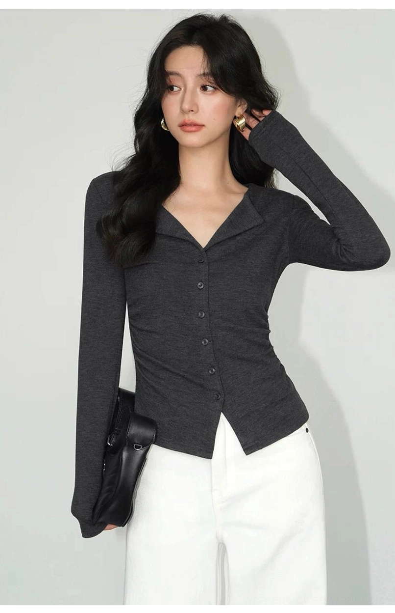 Dark gray slim-fit Korean streetwear cardigan top with notched lapel collar styled with white wide-leg pants and black handbag