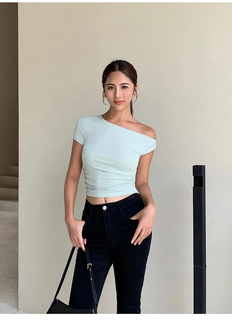 Slim fitted one-shoulder cropped knit top with an elegant collarbone-framing neckline
