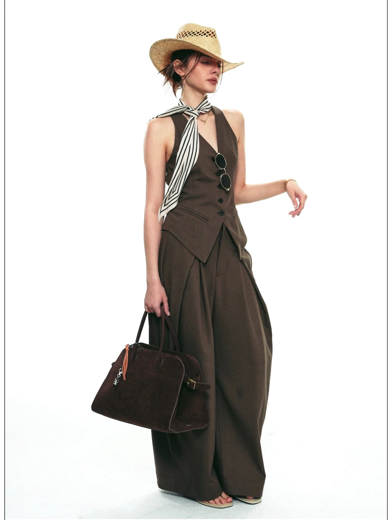 Smoky brown halter vest suit with V-neck tailoring, front buttons, pleated trousers, and retro accessories