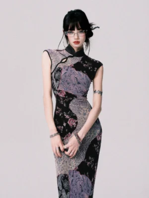 Front full-body view of smoky purple mosaic qipao-inspired maxi dress with black stand collar, asymmetric neckline, and fitted floral paisley patchwork silhouette