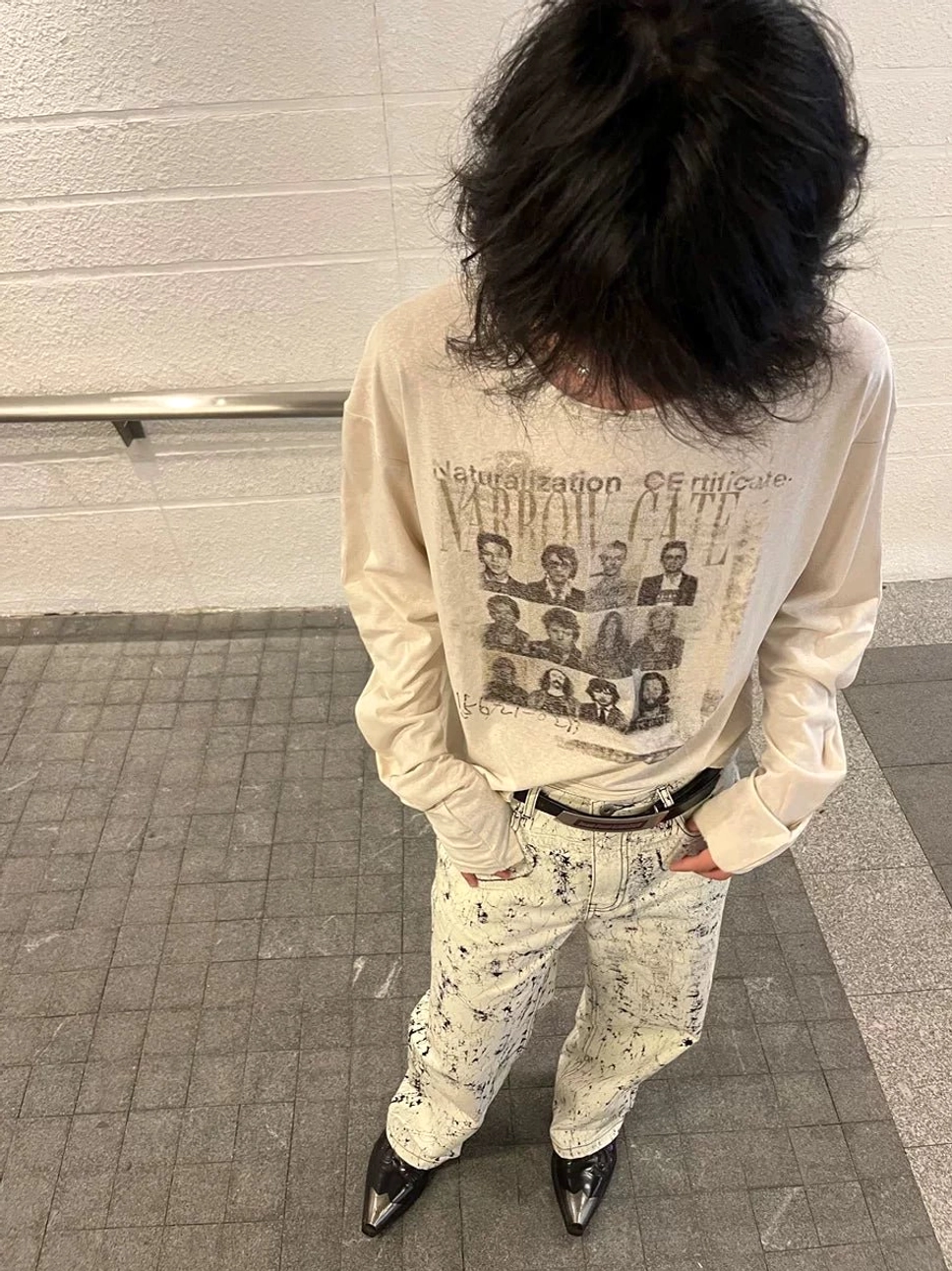Back view of apricot vintage graphic long sleeve tee showing relaxed cropped fit and NARROW GATE back wordmark