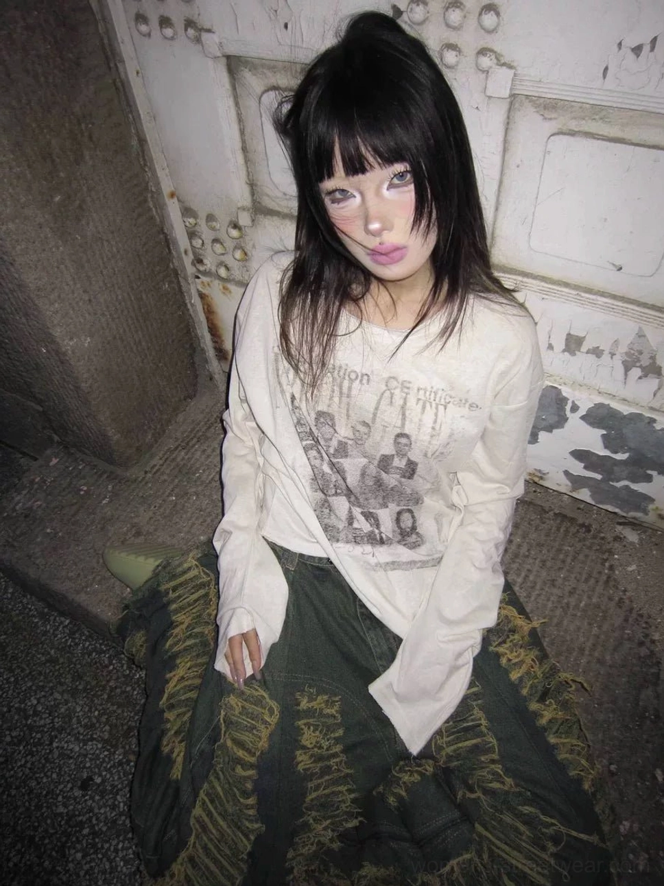 Close front view of soft apricot vintage portrait graphic long sleeve tee with scoop neckline and relaxed streetwear fit