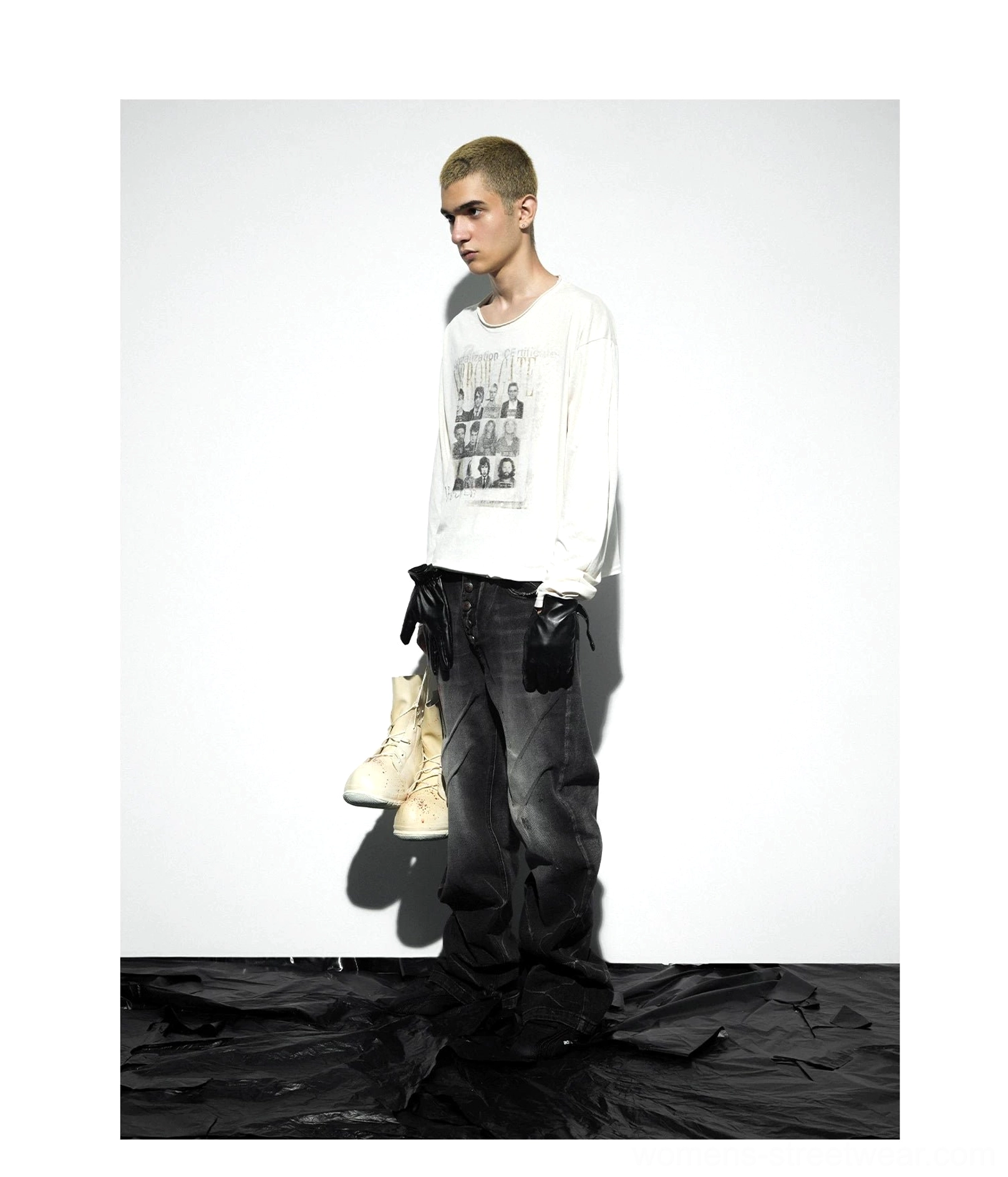 Full body front studio view of apricot oversized vintage graphic long sleeve tee paired with washed black denim