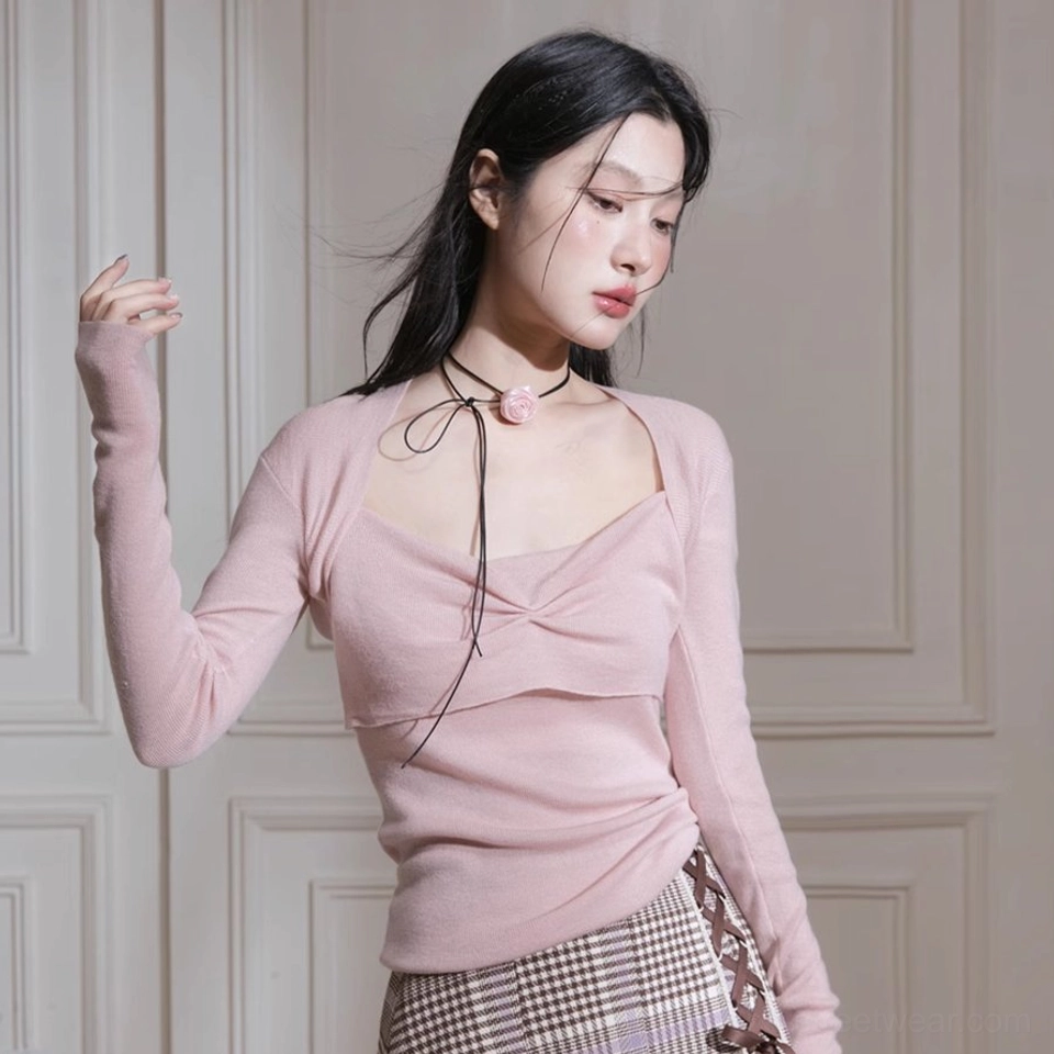 Soft blush pink fitted long sleeve knit top with sculptural twist neckline and square neck design