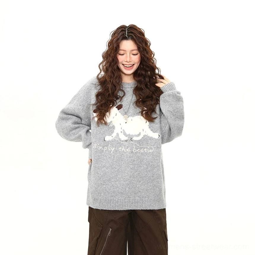 Close front view of soft fuzzy oversized puppy graphic sweater with Simply the bestie lettering