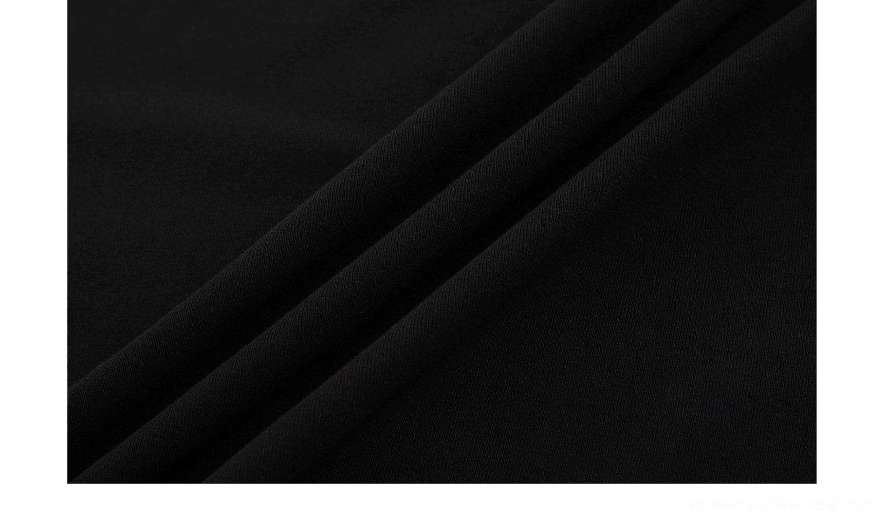 Close-up of soft stretch knit fabric with a smooth matte texture from the butterfly emblem fitted maxi dress