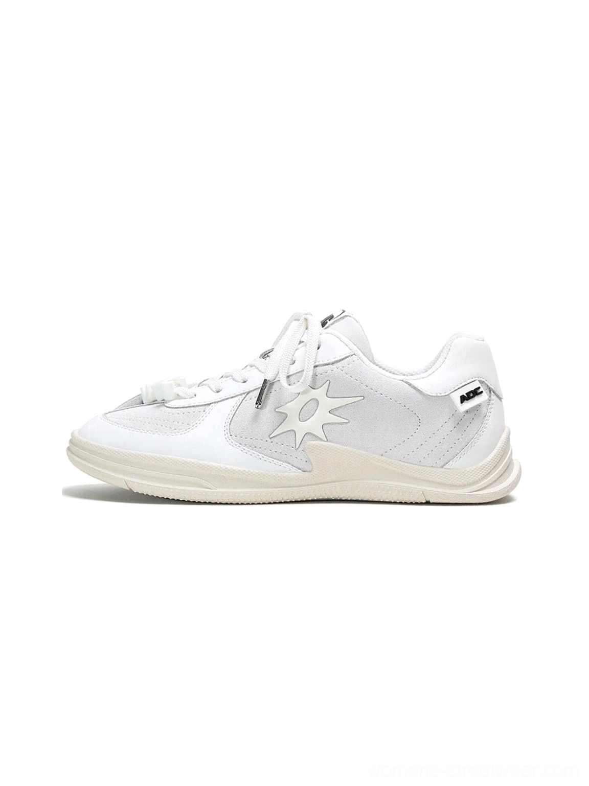 Solar Star Applique Black and White Leather Court Sneakers product image with contrasting low-top streetwear design