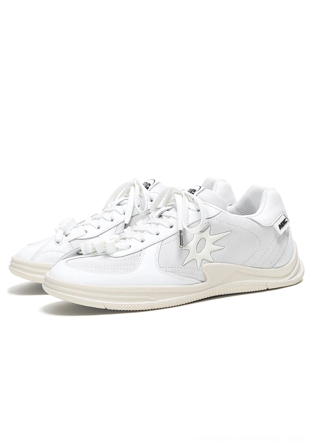 Solar Star Applique Black and White Leather Court Sneakers showing graphic side detailing and everyday court styling
