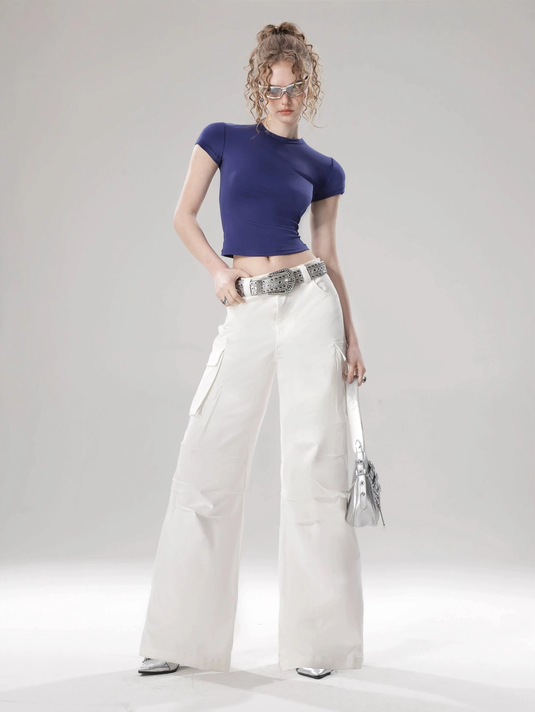 Solid color flutter sleeve cropped top styled for a modern Korean streetwear outfit with fitted silhouette