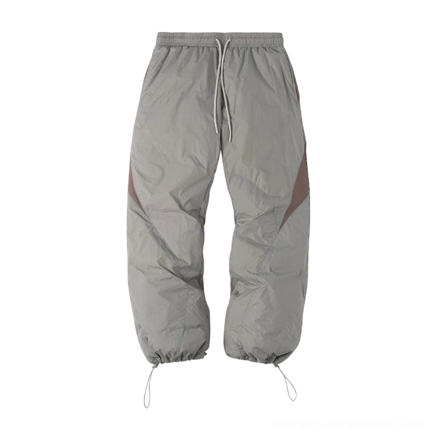Spliced padded streetwear pants with 90 percent duck down insulation relaxed fit and splash-proof outer fabric