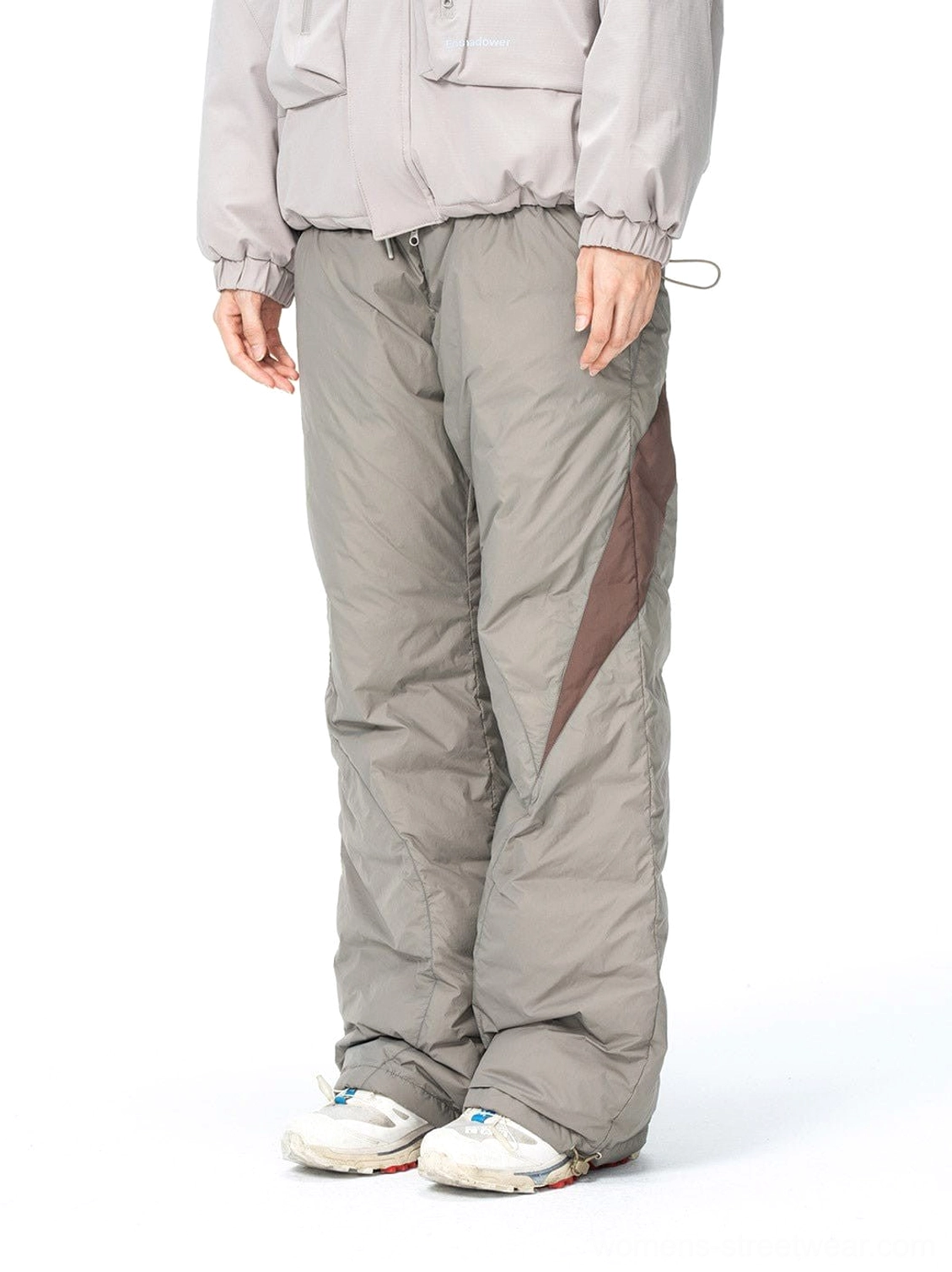 Front view of taupe gray and dark brown spliced padded streetwear track pants with a relaxed wide-leg fit