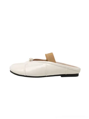 Silver split-toe open-back mule flats with knotted front detail, elastic strap, and low rubber outsole shown in a standalone side view