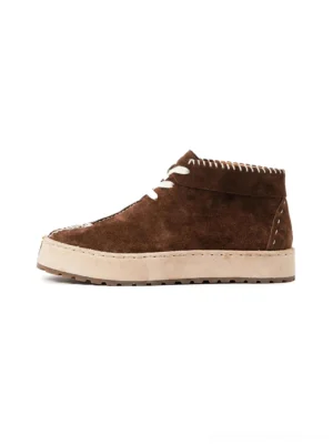 Dark brown split-toe suede-finish leather lace-up chukka boots shown from a left three-quarter angle with contrast stitching and thick off-white sole