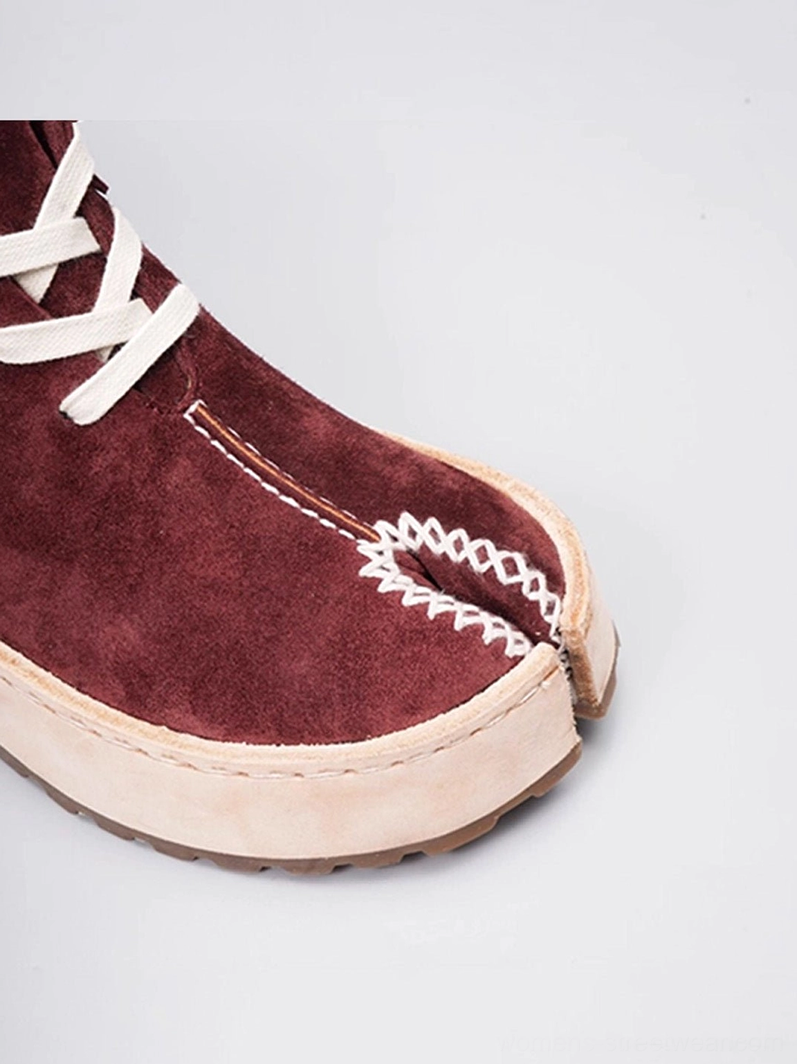 Split-toe suede-finish leather chukka boots with lace-up ankle closure and contrast stitching styled for contemporary streetwear
