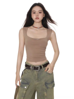 Khaki square neck cropped camisole tank top styled with vintage cargo jeans in a minimalist streetwear studio look