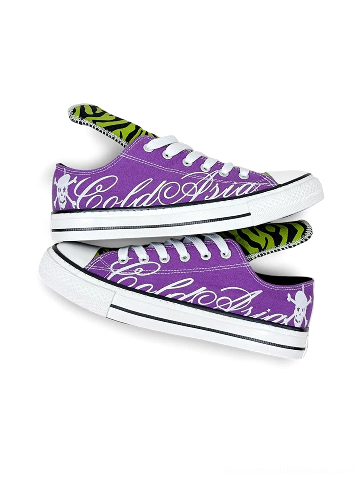 Stacked side view of purple zebra tongue sneakers with white rubber toe caps and soles, bold cursive graphics, and skull details on both heels