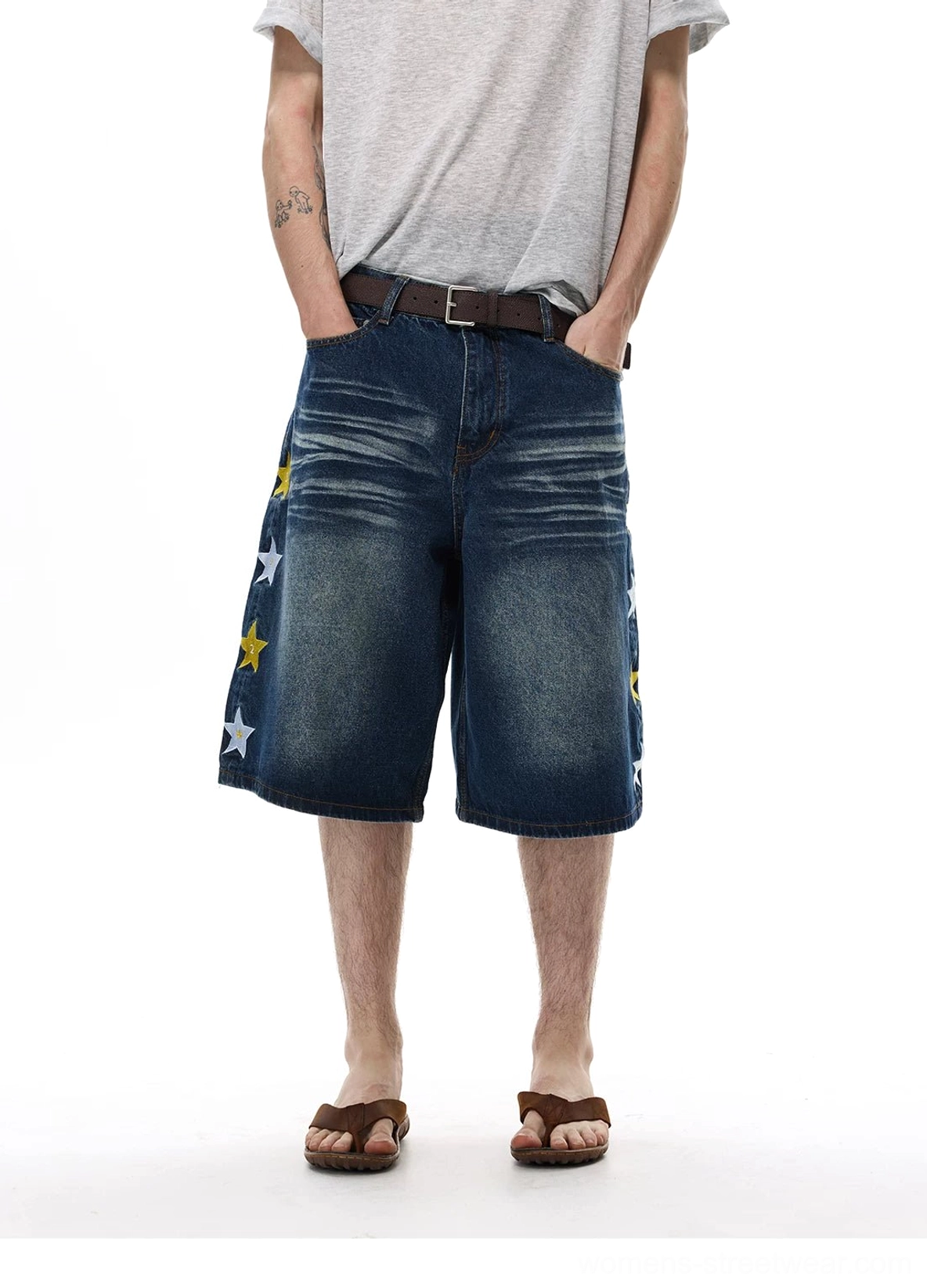 Star appliqué wide-leg denim knee shorts featuring relaxed knee-length skater-inspired proportions